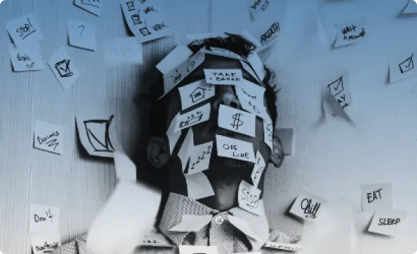 A person buried under sticky notes reading take a break, stop, eat and sleep